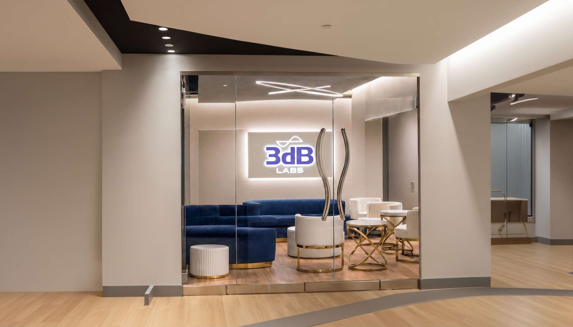 The 3dB Labs office entrance in West Chester, Ohio, with the illuminated 3dB Labs sign behind glass doors