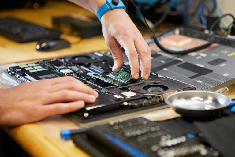 Engineers building hardware by hand